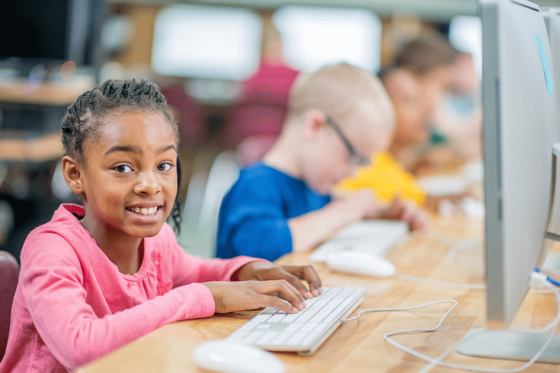 multi racial class , african kid typing the keyboard , computer screen